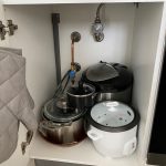 Cluttered Kitchen Cabinet With Wasted Space, Needs An Extra Shelf