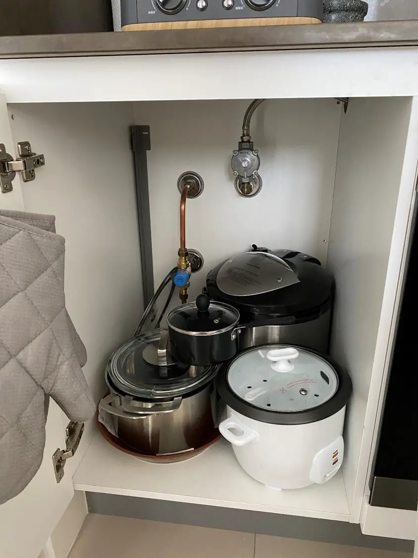 This Lid Organizer Instantly Made My Cabinets Looks Less Cluttered