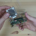 Heat Sink Being Installed On Raspberry Pi