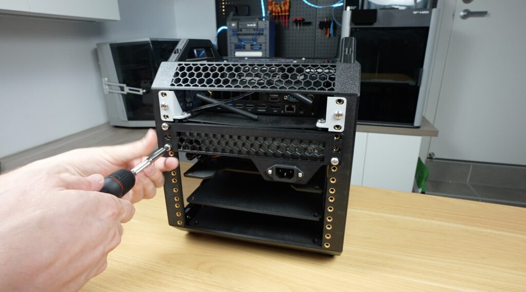 Screwing Power Supply Shelf Into Place